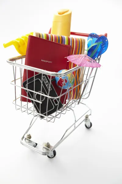Trolley full of items for holiday — Stock Photo, Image