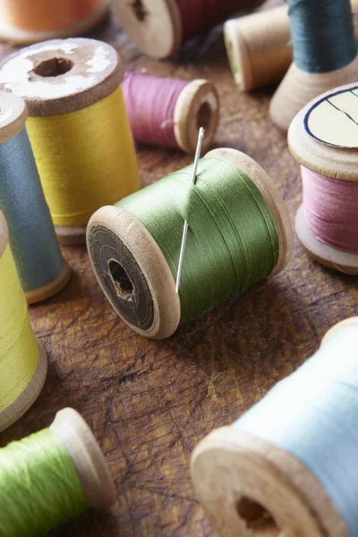 stock image Cotton reels on table top