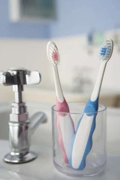 Toothbrushes in bathroom — Stock Photo, Image