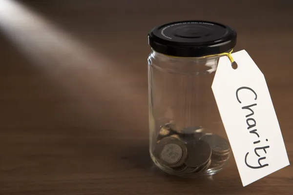Coins in a jam jar — Stock Photo, Image