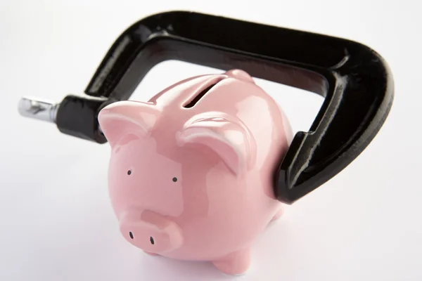 Piggybank in a vice — Stock Photo, Image