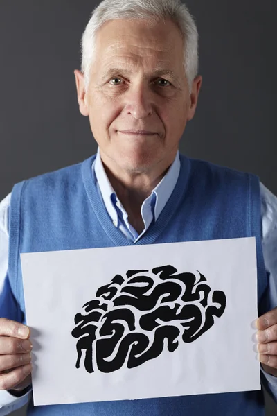 stock image Senior man holding ink drawing of brain