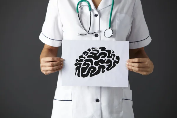 American nurse holding ink drawing of brain — Stock Photo, Image