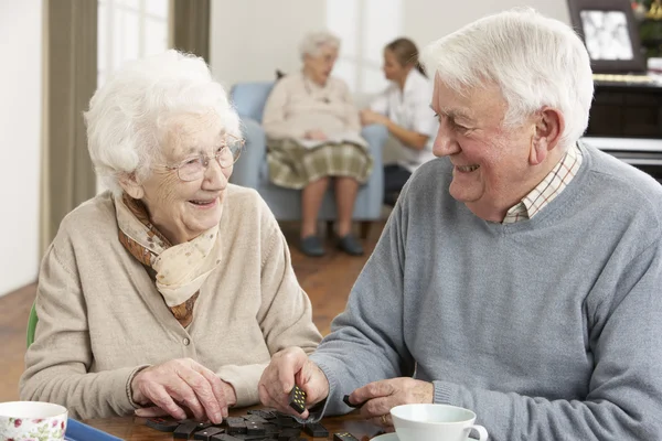 Couple Playing Dominoes At Day Care Centre — Stock Photo, Image