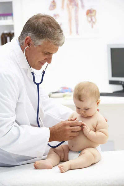 Pediatrician with baby Royalty Free Stock Photos