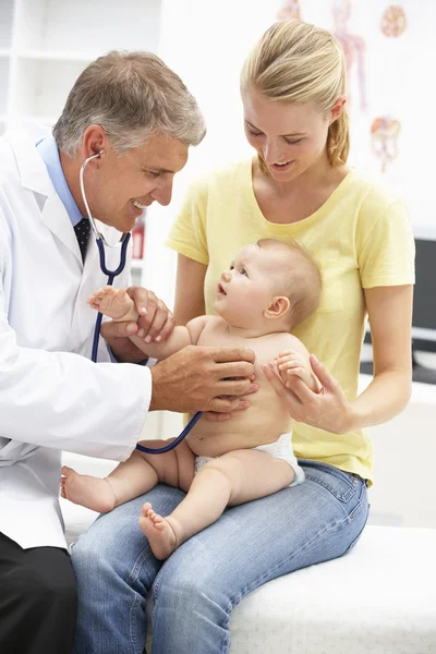 Pediatrician with baby Royalty Free Stock Images