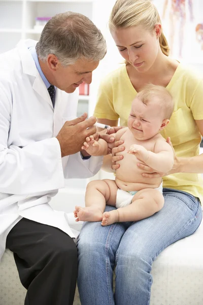 Pediatrician with baby Royalty Free Stock Photos