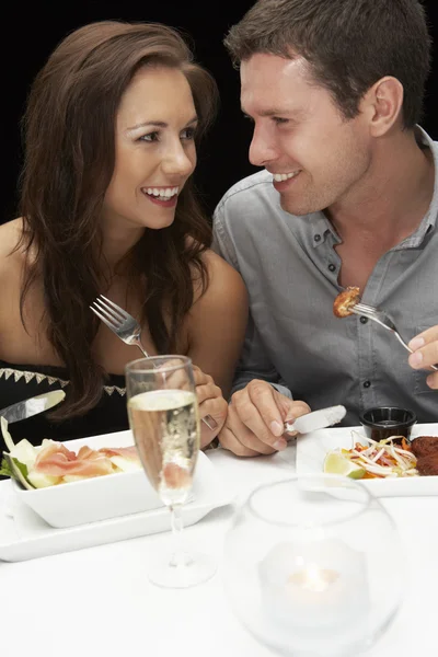 Young couple in restaurant Royalty Free Stock Photos