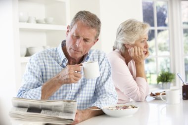 Retired couple eating breakfast clipart