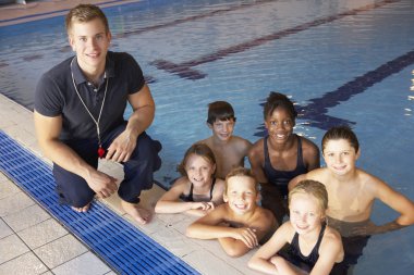 Children having swimming lesson clipart