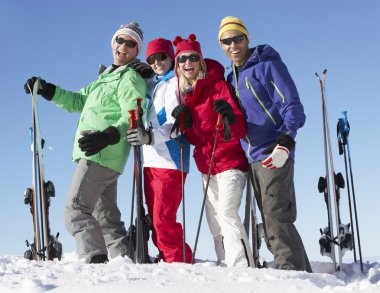 Group Of Middle Aged Couples On Ski Holiday In Mountains clipart