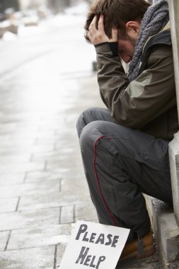 Homeless Young Man Begging In Street clipart