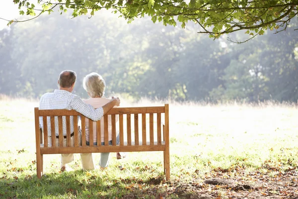Senior couple sitting outdoors — Stock Photo, Image
