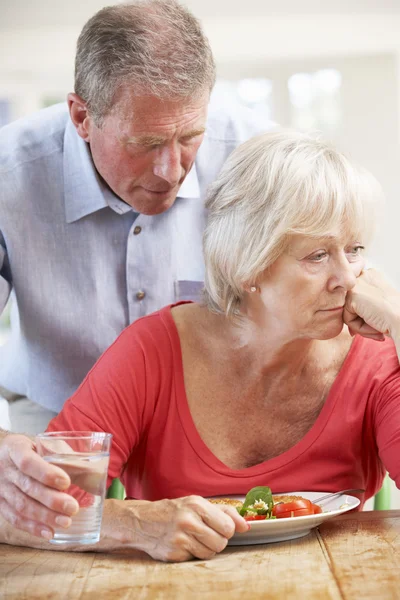 Senior man looking after sick wife — Stock Photo, Image