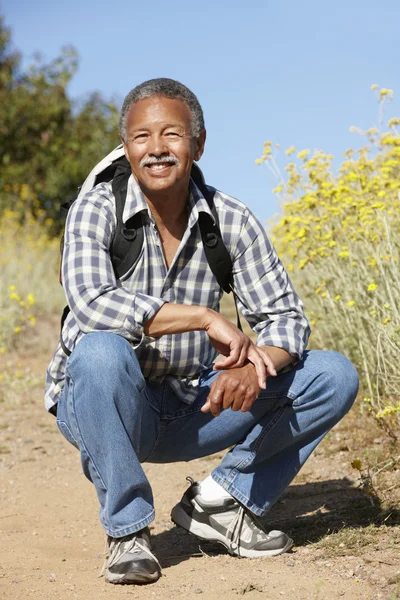 Senior man on country hike — Stock Photo, Image