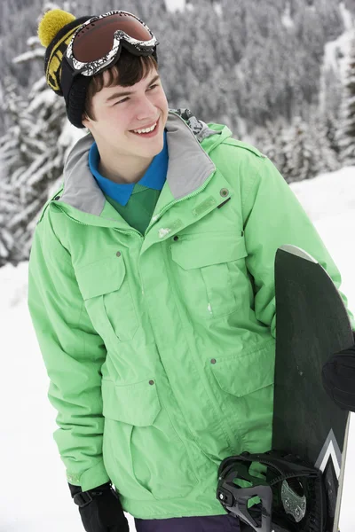 Tizenéves fiú, a Snowboard, a sí ünnep-hegység — Stock Fotó