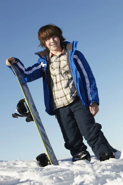 Young Boy With Snowboard On Ski Holiday In Mountains — Stock Photo, Image