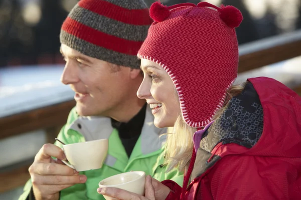 Couple Enjoying Hot Drink In Café At Ski Resort — Zdjęcie stockowe