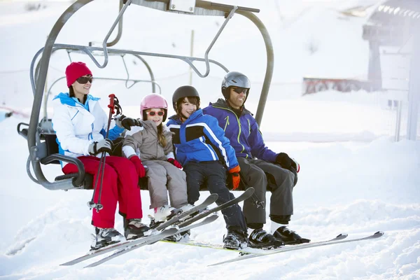 Family Getting Off chair Lift On Ski Holiday In Mountains Royalty Free Stock Photos