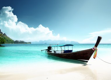 Long boat and poda island in Thailand clipart