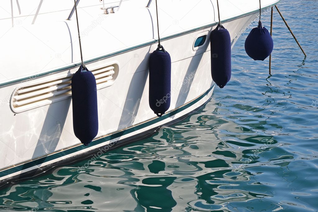 Blue fenders sailing boat