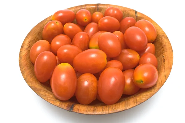 Plum tomatoes in wooden dish — Stock Photo, Image