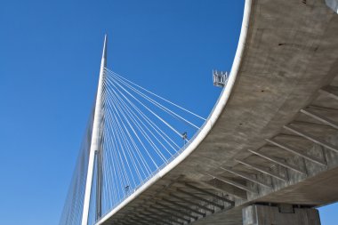 Overpass to bridge over blue sky clipart