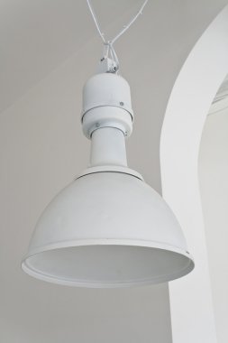 White ceiling lamp in large hall clipart