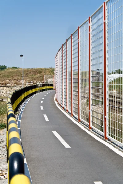Bicycle path and fence — Stok fotoğraf