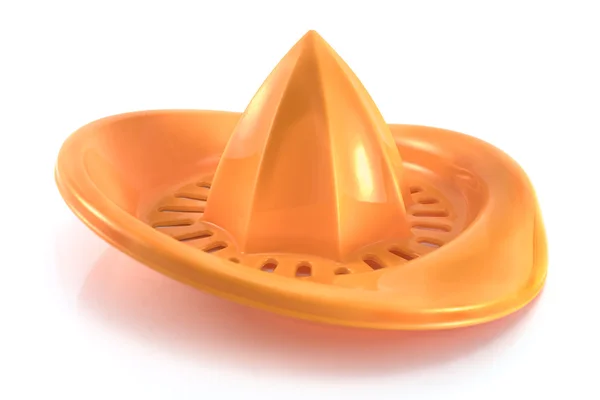 Апельсиновый пластиковый лимонный сжиматель — стоковое фото