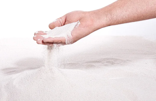 Песок бежит сквозь руки — стоковое фото