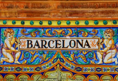 Barcelona sign over a mosaic wall
