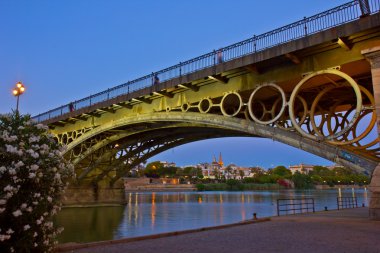 Triana Bridge at night, Seville, Spain clipart