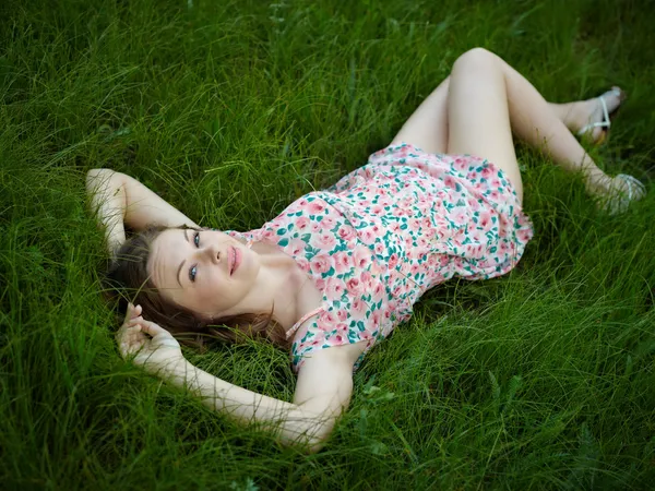 stock image The woman lies in a grass