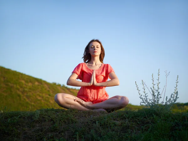 stock image The woman meditates in a lotus pose