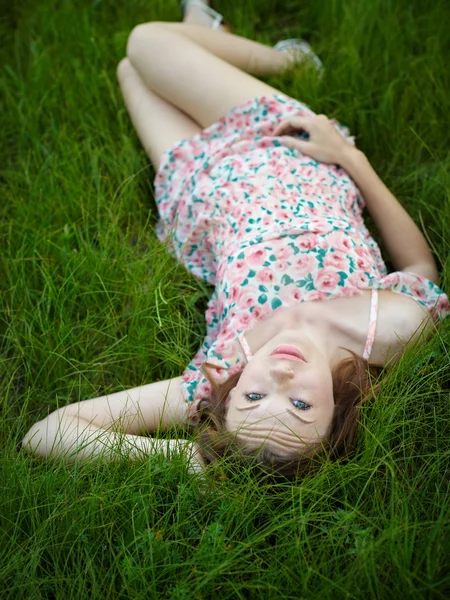 stock image The woman lies in a grass