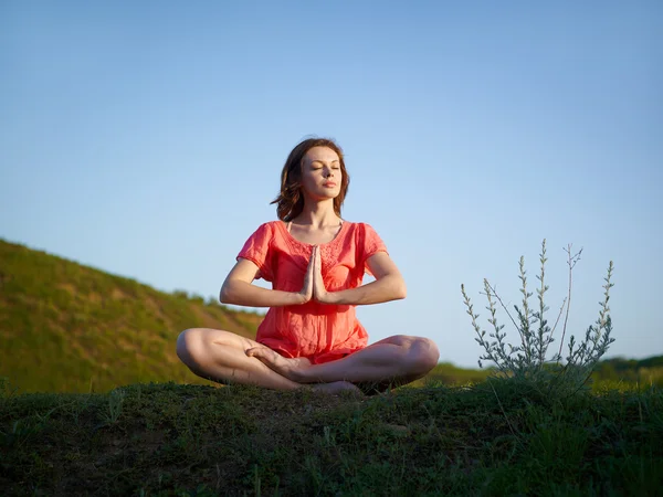 stock image The woman meditates in a lotus pose