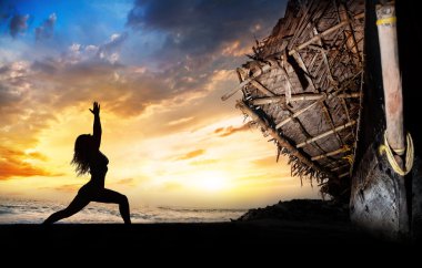 Yoga silhouette warrior pose near boat clipart