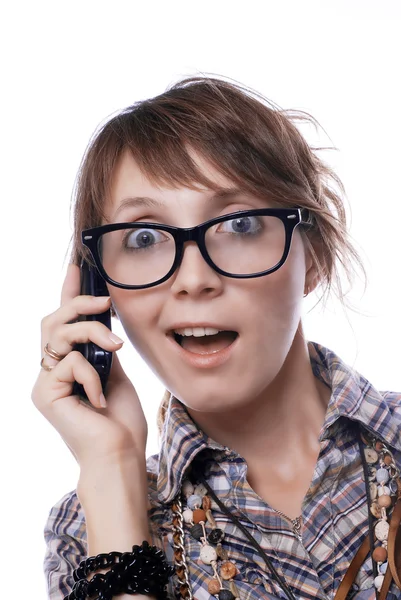 Chica sorprendida con un teléfono móvil —  Fotos de Stock