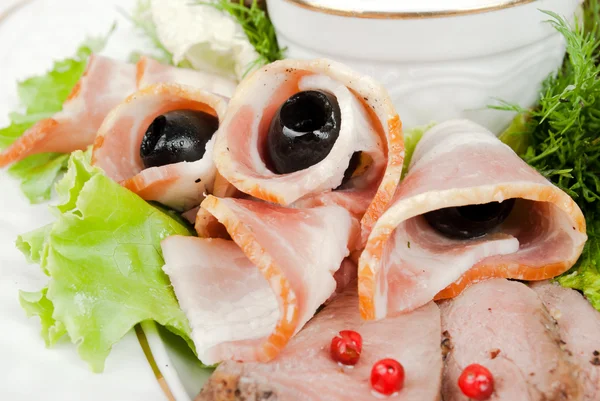 Sliced bacon with olives — Stock Photo, Image