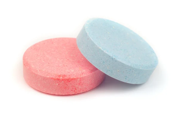 Две таблетки. розовый и синий — стоковое фото