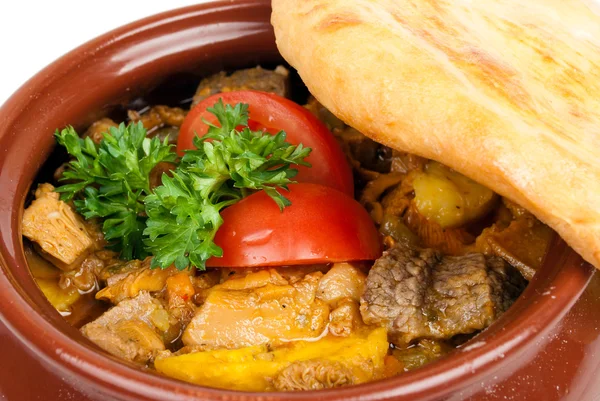 stock image Meat with mushrooms baked in a pot