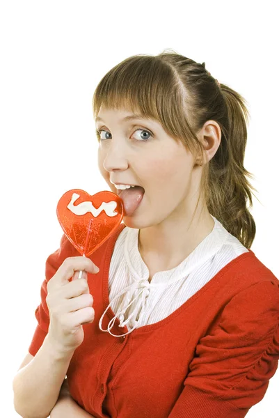 Attractive girl with heart lolly pop — Stock Photo, Image