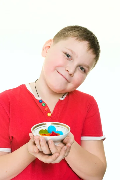 Boy with candies — Stock Photo, Image