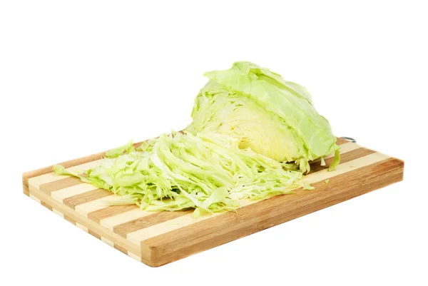 Green cabbage sliced on cutting board isolated on white — Stock Photo, Image