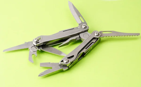 stock image Multitool isolated ower green background