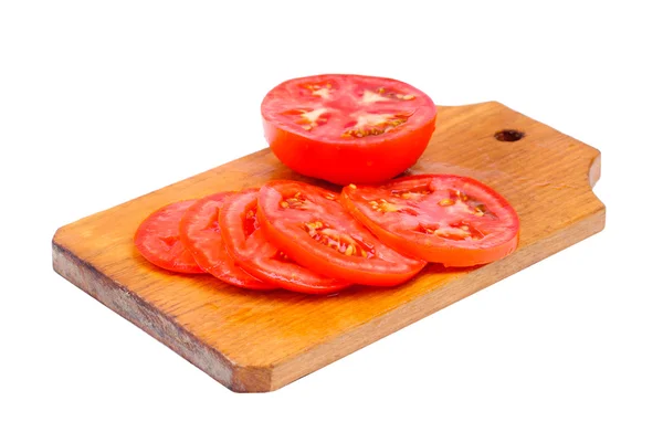 Whole and sliced fresh red tomatoes on cutting board isolated on white background — Stock Photo, Image