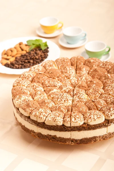 stock image Sweet tiramisu cake with almonds and cups