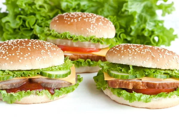 Three burger with meat and vegetables — Stock Photo, Image