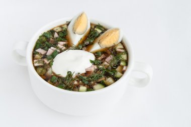 Okroshka cold kvass soup with chopped vegetables and eggs clipart